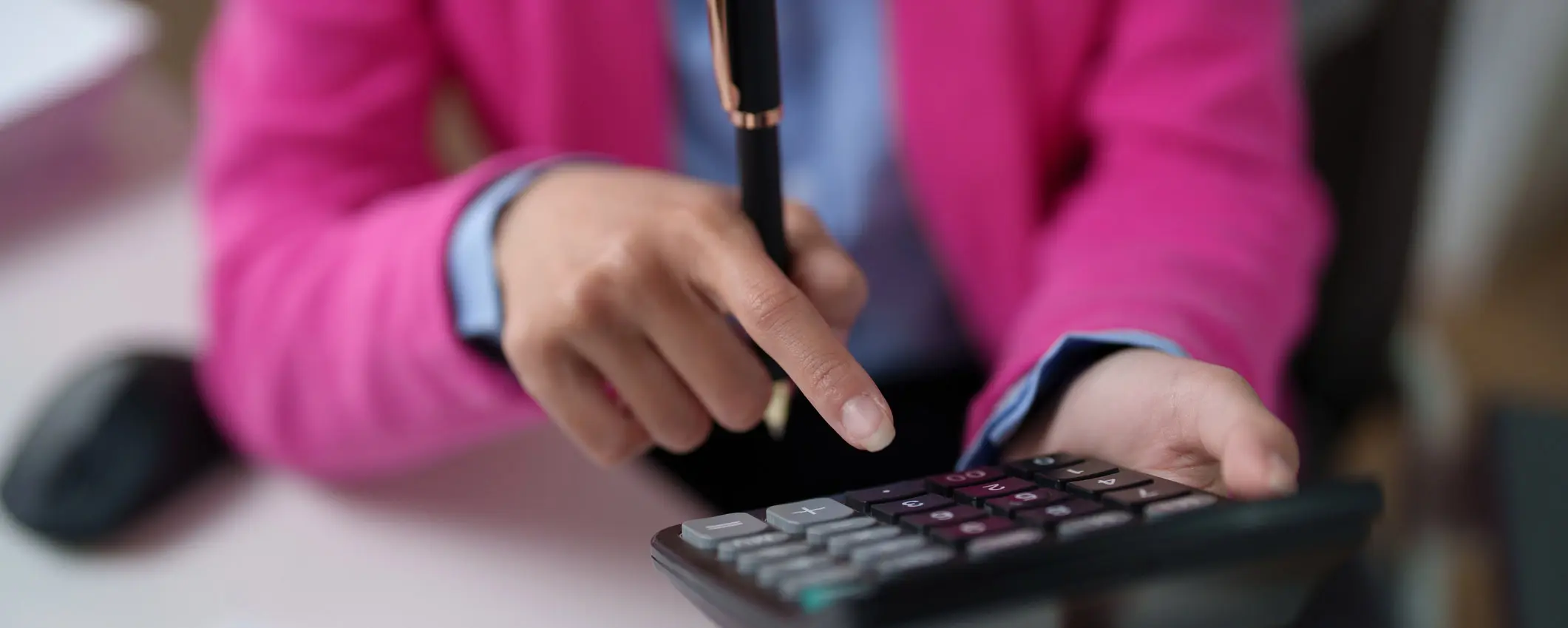 Woman using calculator