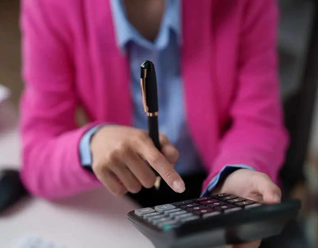 Woman using calculator